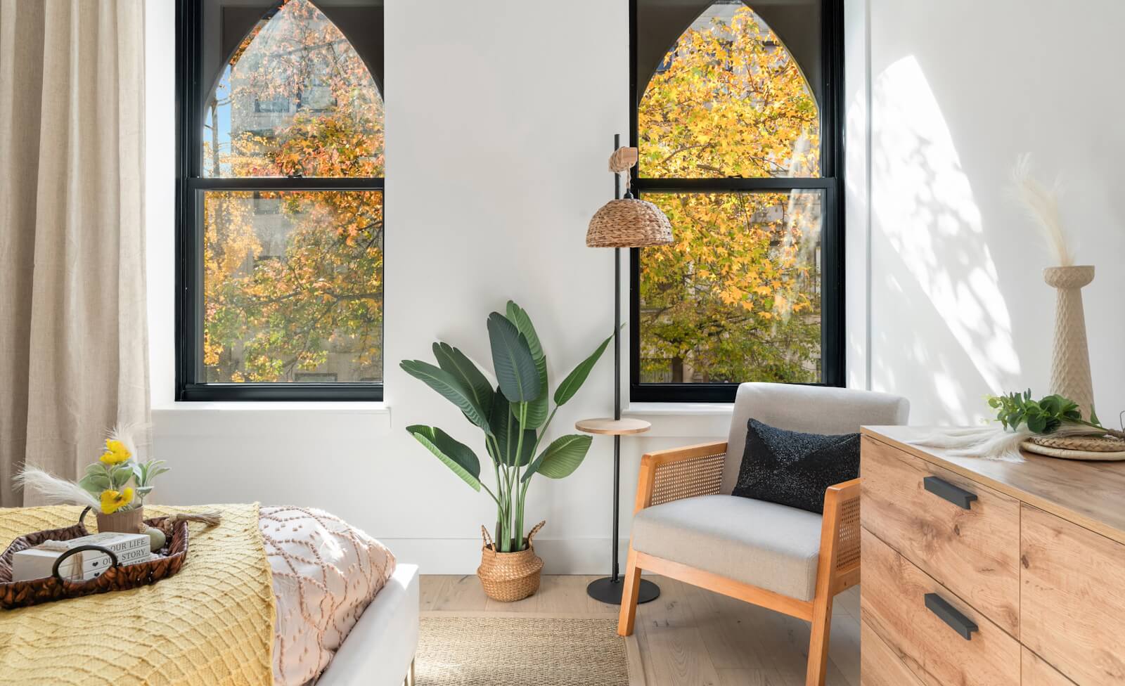 Stylish condo bedroom overlooking tree-lined street in Hamilton Heights Harlem at 463 West 142nd Street condos in NYC.