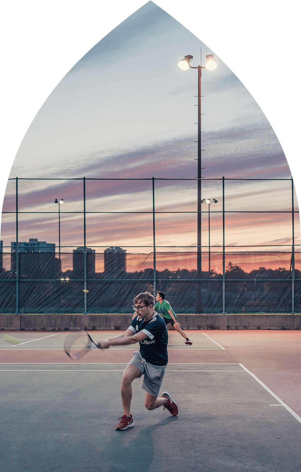 Man playing tennis at tennis court in Harlem NYC near Hamilton Heights condo at 463w142.